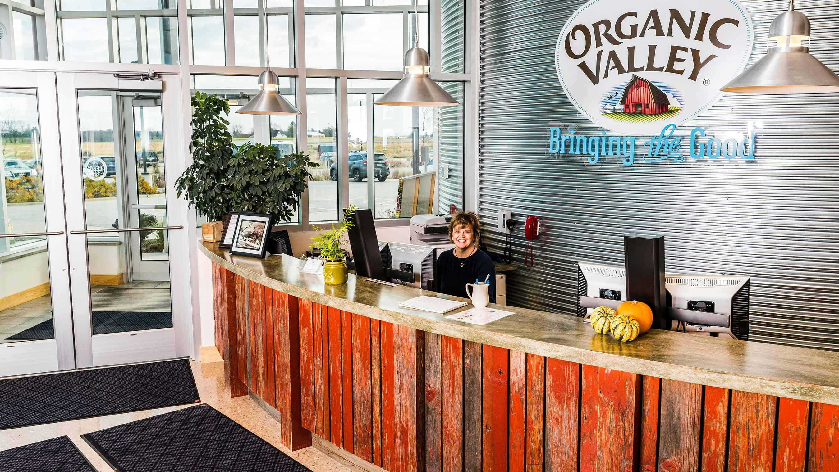 A woman at the front desk of Organic Valley's office building.
