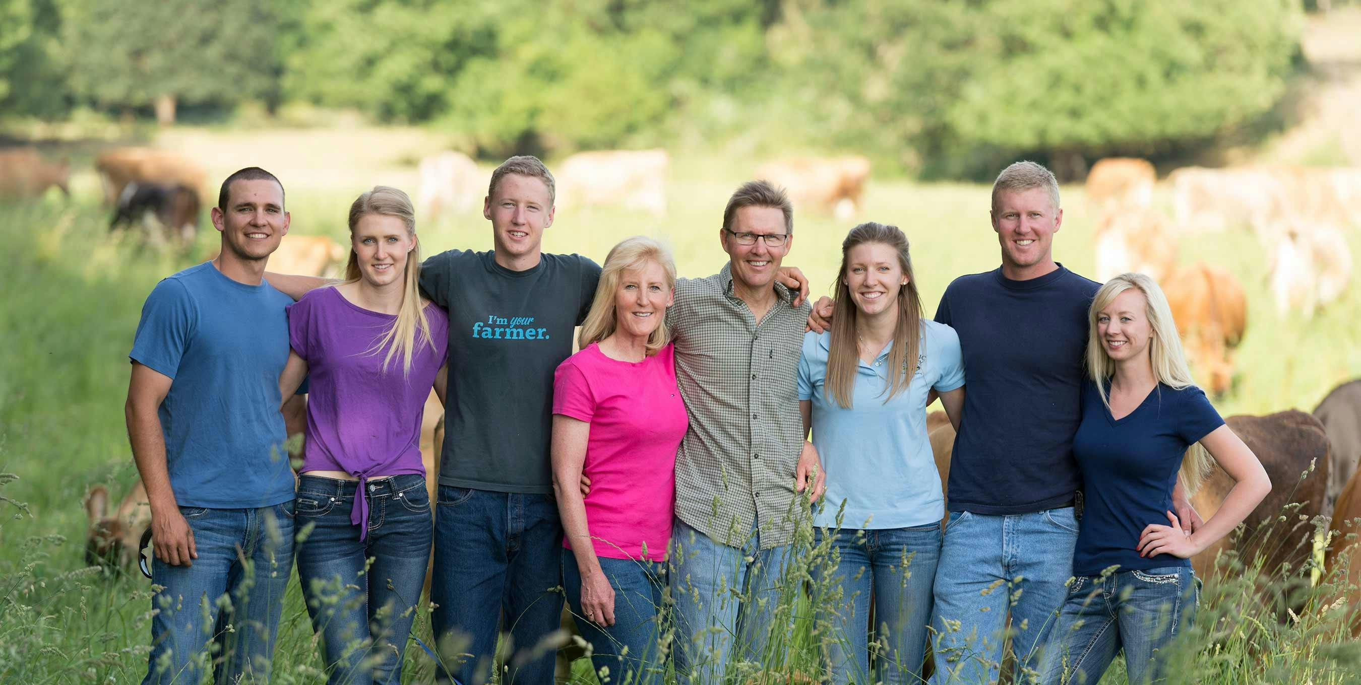 The Bansen Family standing together on their farm, Double J Jerseys, Inc., in Monmouth, OR.