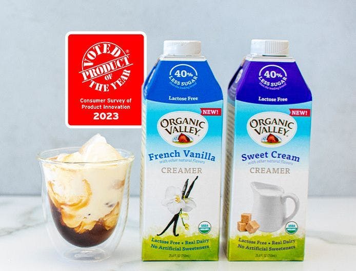 New Organic Valley Lactose-Free Flavored Creamers sitting on a tabletop.