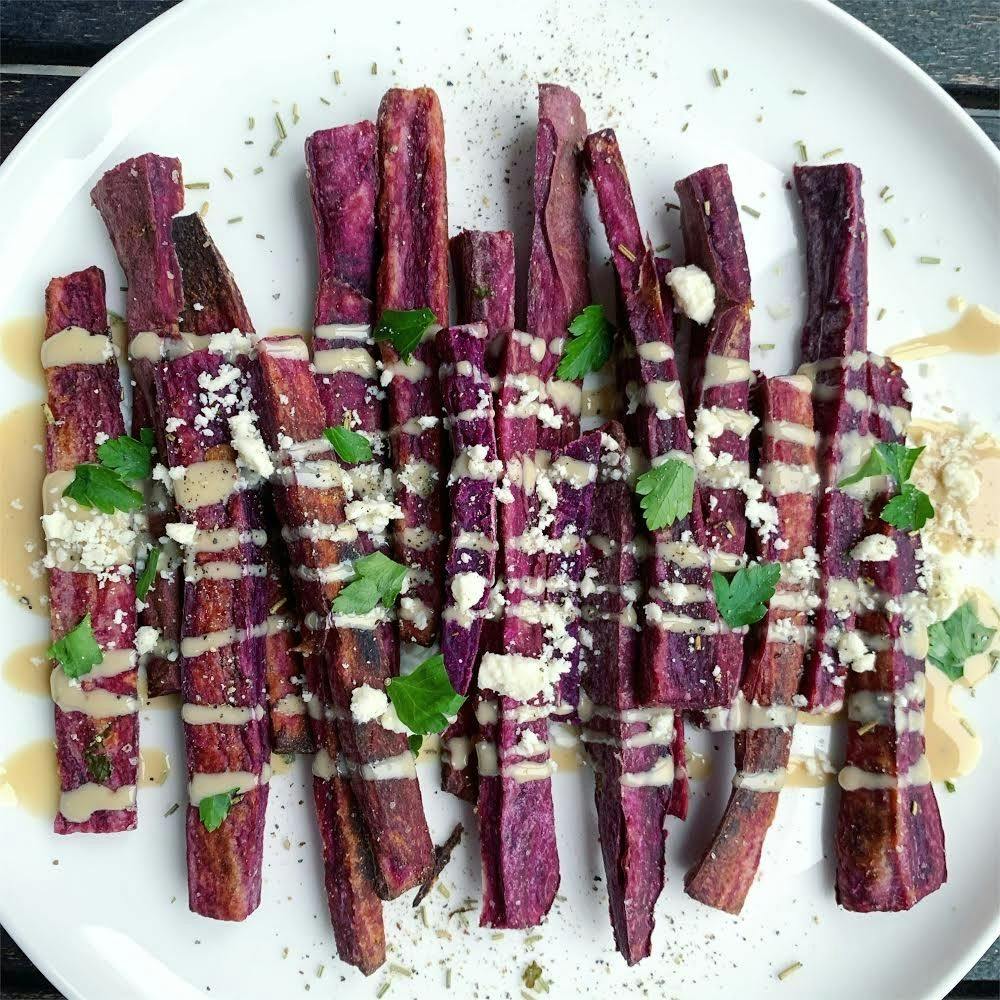 Purple sweet potato slices drizzled with tahini sauce. Photo contributed by Jennifer Combs.