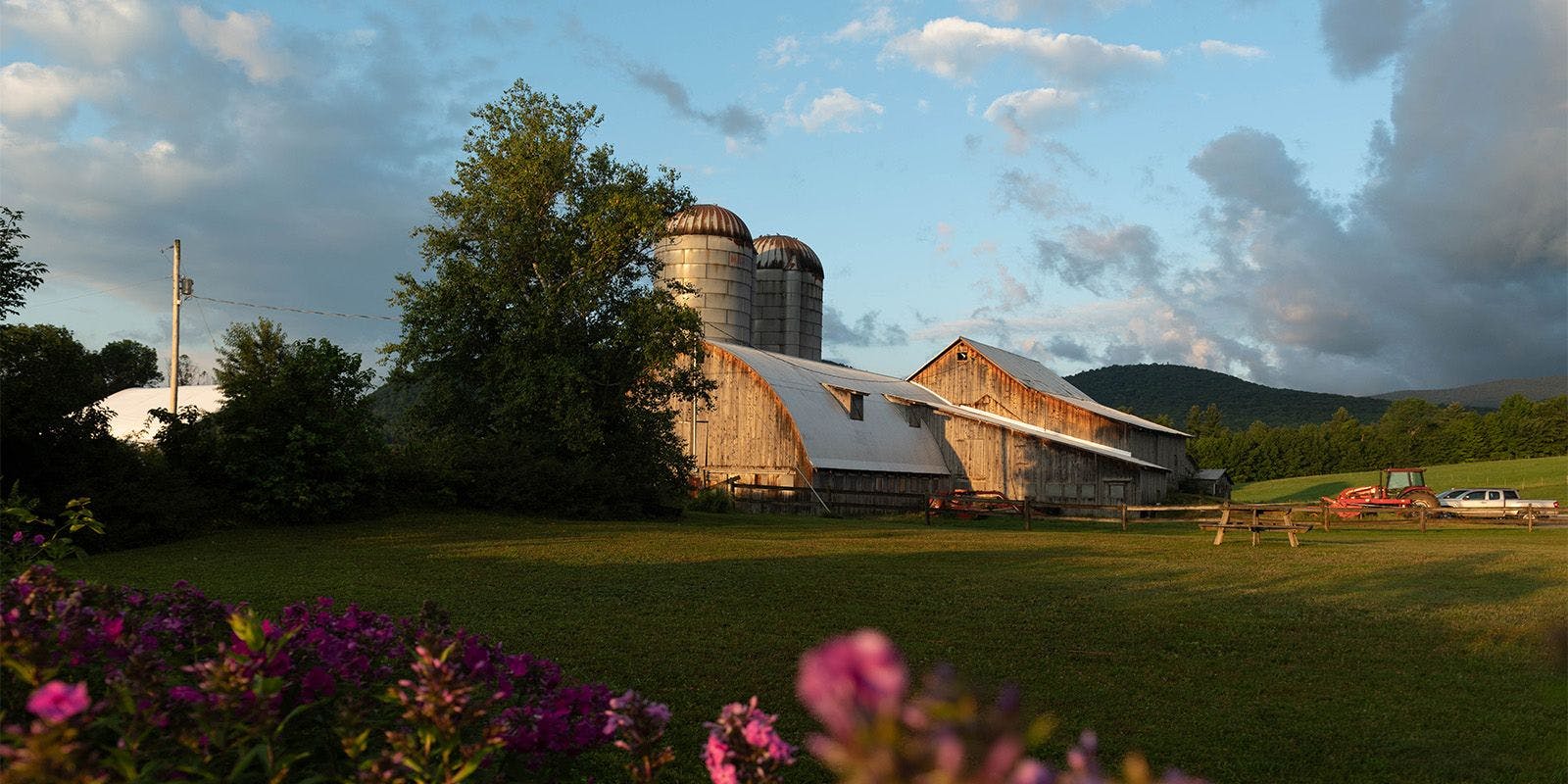 A barn and silos at the Rooney’s small organic farm in Vermont.