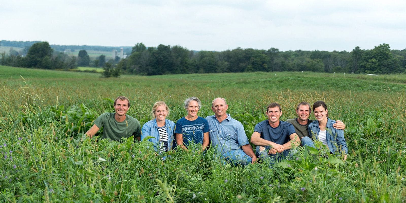 The Gasser family of Ohio poses for a photo in a meadow.