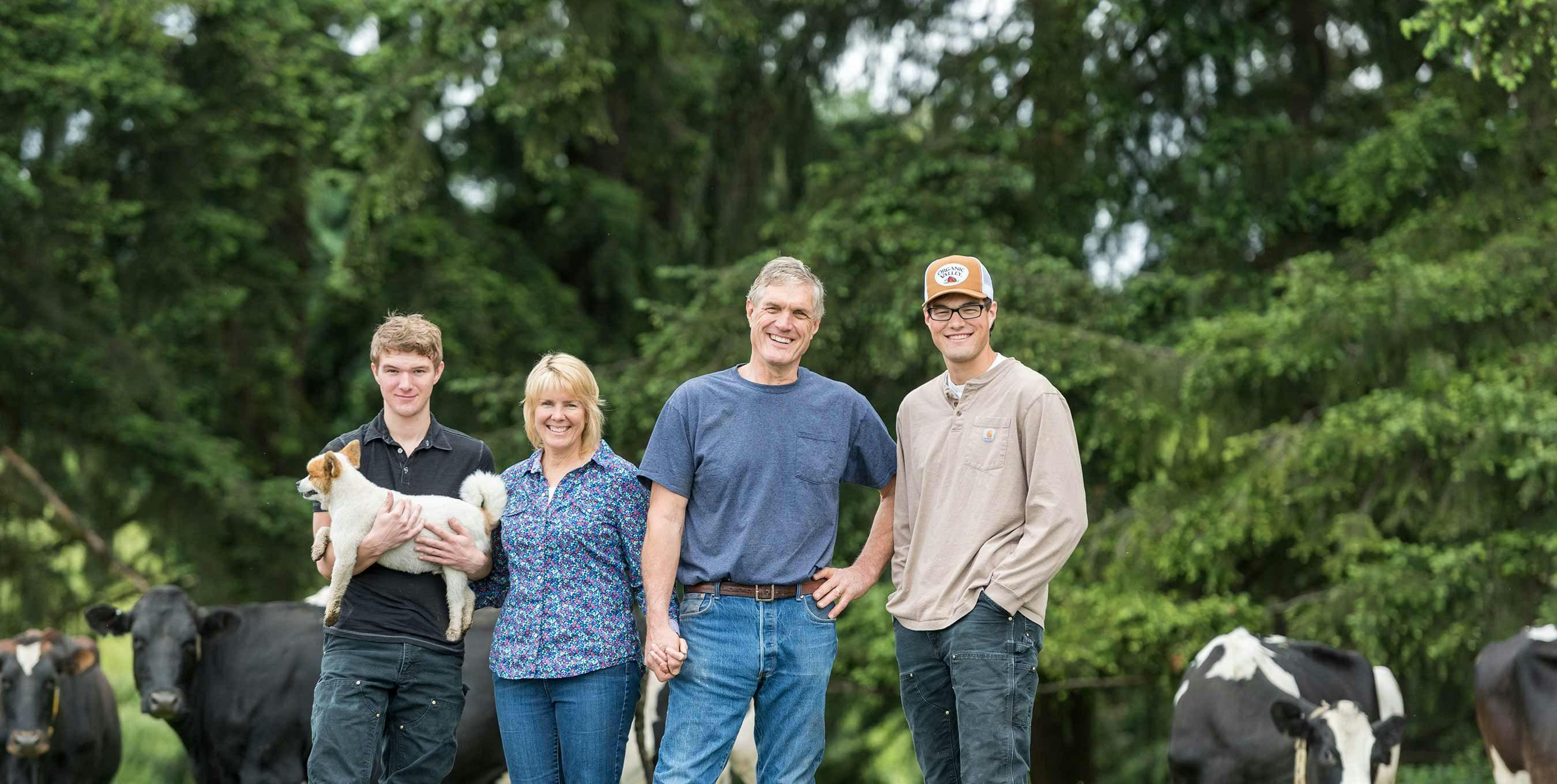 The van Tol family standing together on their farm in La Center, WA.