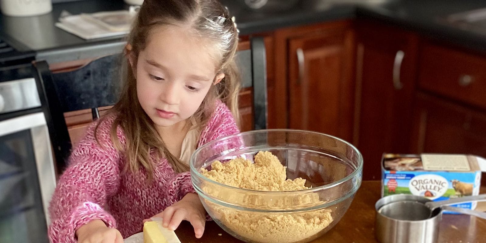 Young girl adds Organic Valley butter to the bowl. Contributed by Jackie Thesing.