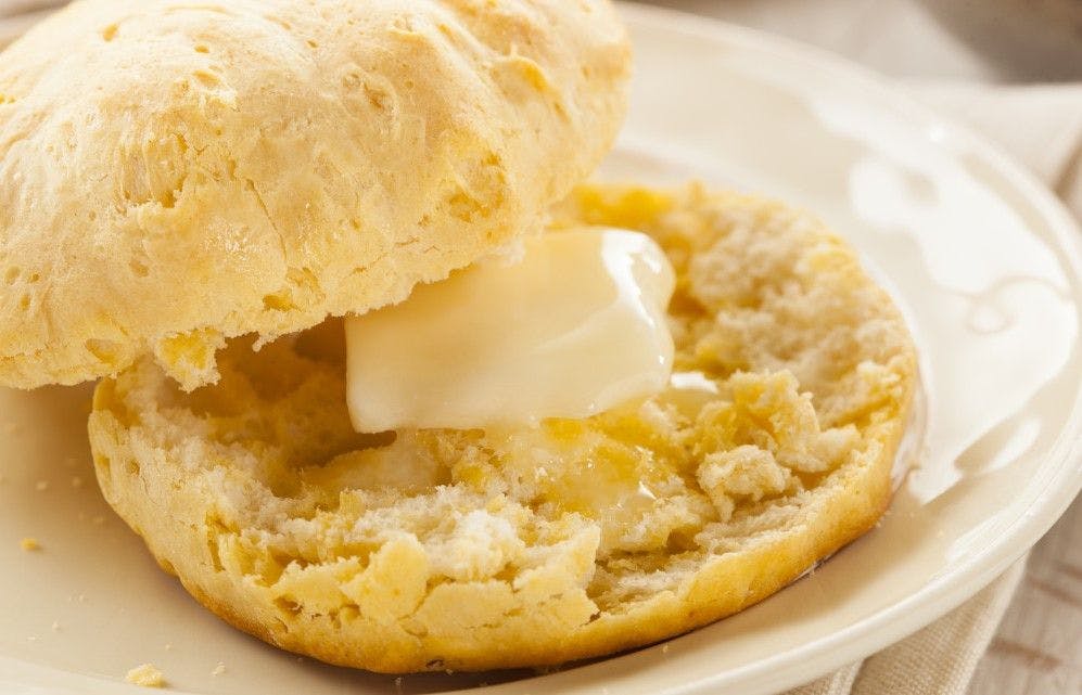Butter melts on a warm buttermilk biscuit.